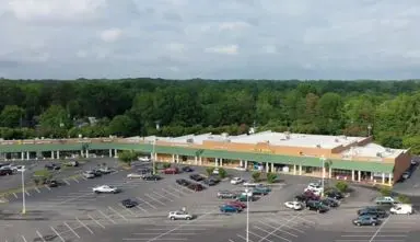 A parking lot with many cars parked in it